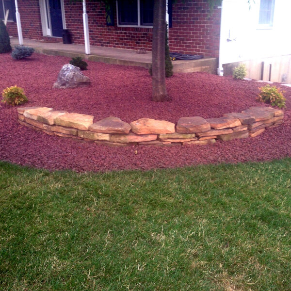 landscape 3 picture of a planter with red stone